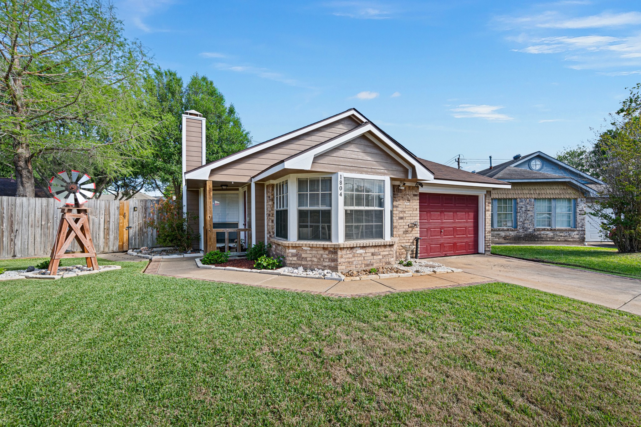 1804 Spruce Drive Rosenberg, TX 77471 - Photo 2 of 29 a front view of a house with a yard and outdoor seating