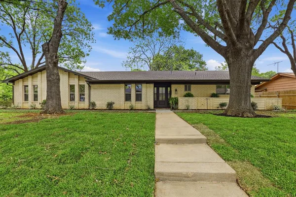 front view of a house with a yard