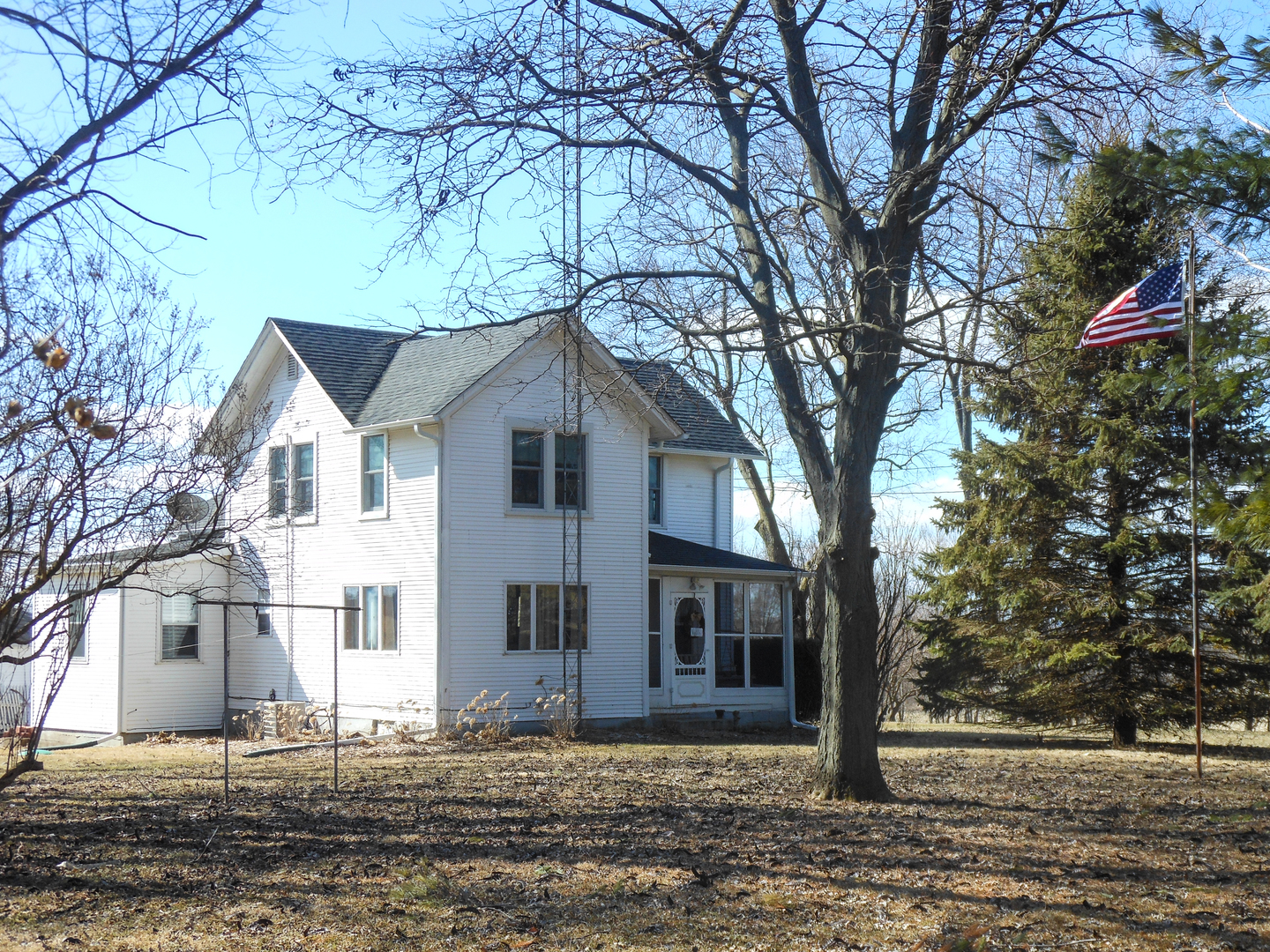 3365 Hermann Road Lee, IL 60530 - Photo 1 of 63 a white house that has a tree in front of it