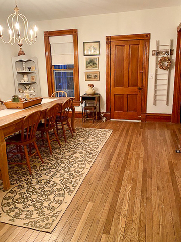 3365 Hermann Road Lee, IL 60530 - Photo 10 of 63 a dining room with wooden floor a chandelier a glass table and chairs