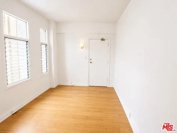 a view of an empty room with a window