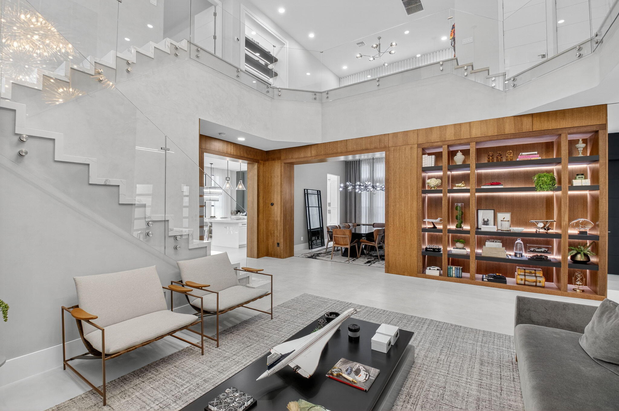 9083 Benedetta Place Boca Raton, FL 33496 - Photo 13 of 112 a living room with furniture gym equipment and a large window