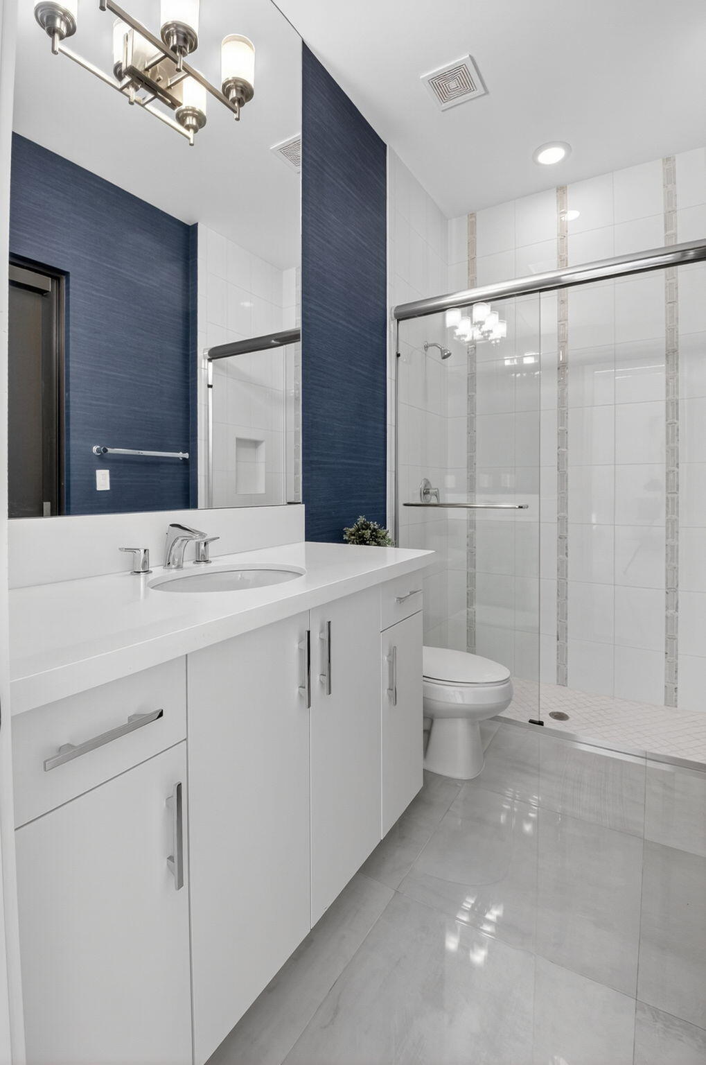 9083 Benedetta Place Boca Raton, FL 33496 - Photo 31 of 112 a bathroom with a double vanity sink toilet and shower