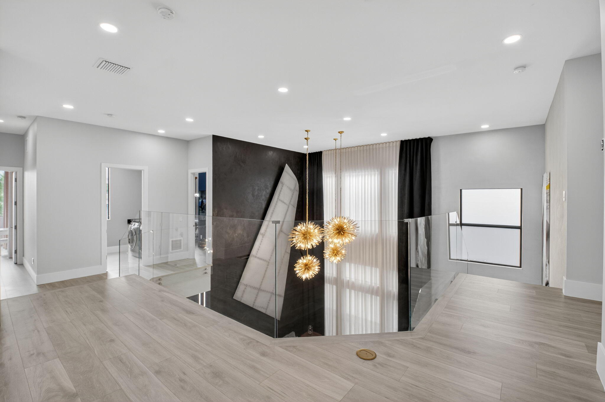 9083 Benedetta Place Boca Raton, FL 33496 - Photo 38 of 112 a view of a hallway with wooden floor