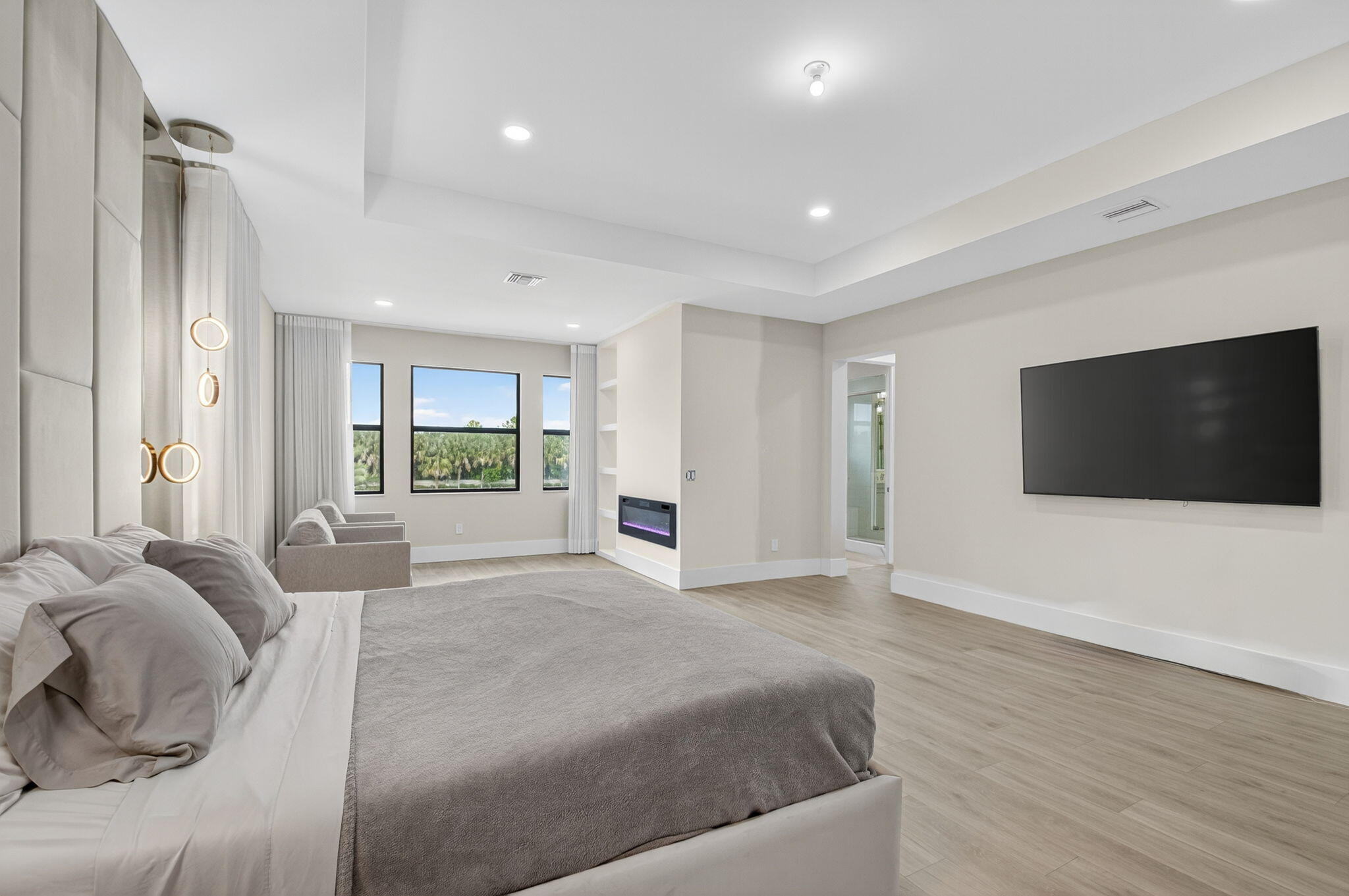 9083 Benedetta Place Boca Raton, FL 33496 - Photo 55 of 112 a spacious bedroom with a large bed and a flat screen tv