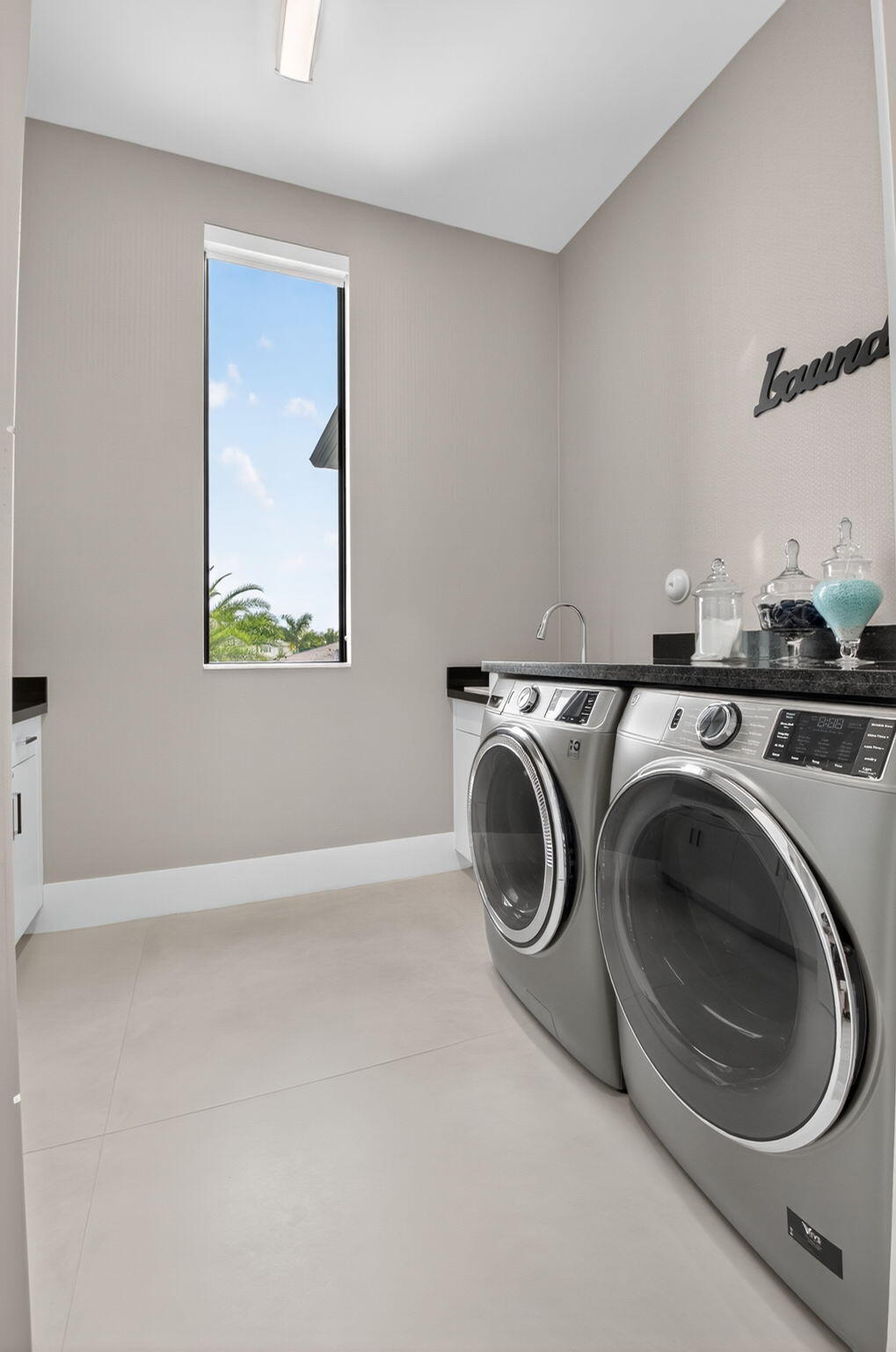 9083 Benedetta Place Boca Raton, FL 33496 - Photo 60 of 112 a utility room with dryer and washer