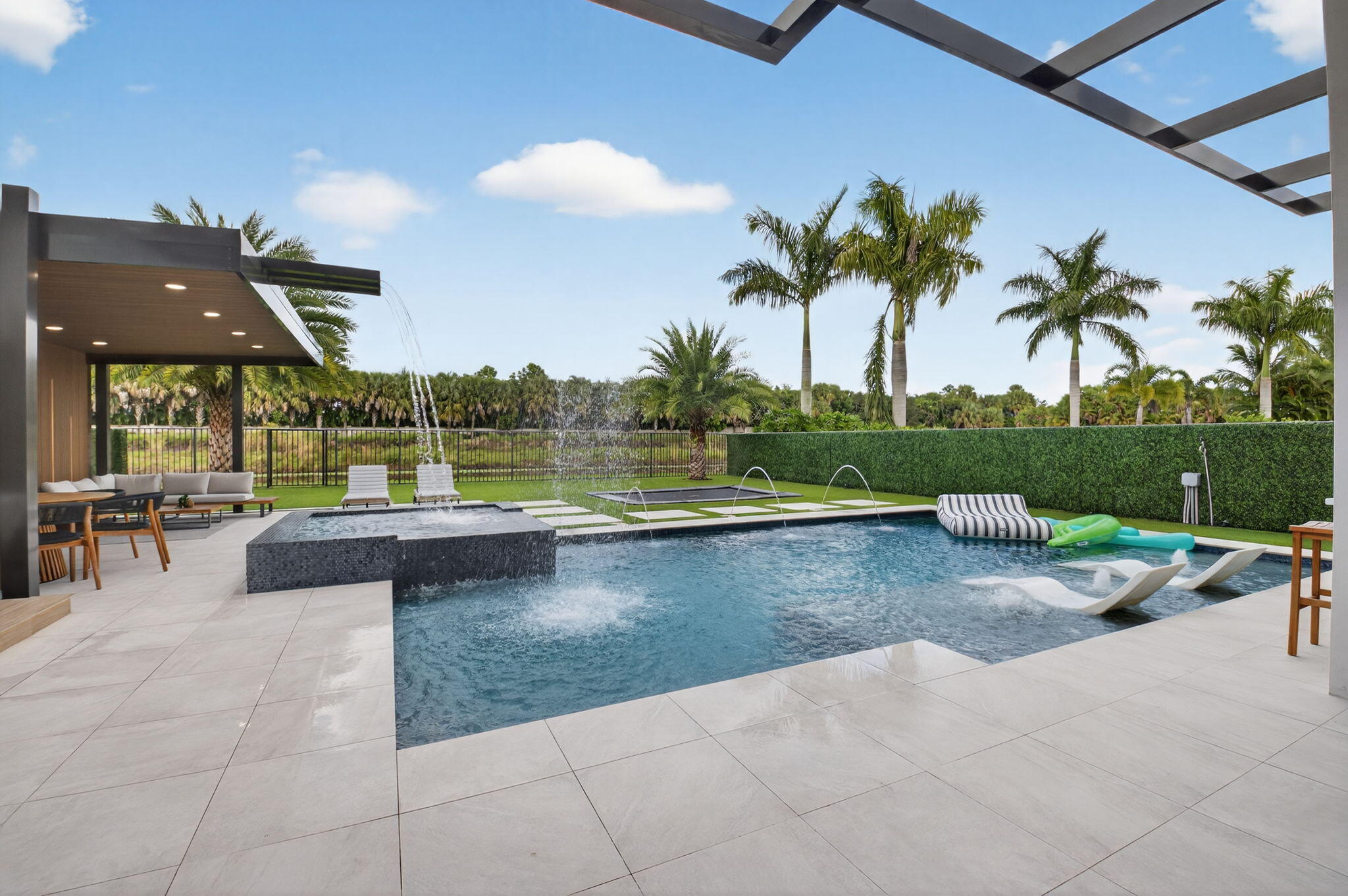9083 Benedetta Place Boca Raton, FL 33496 - Photo 61 of 112 a view of swimming pool with outdoor seating and plants