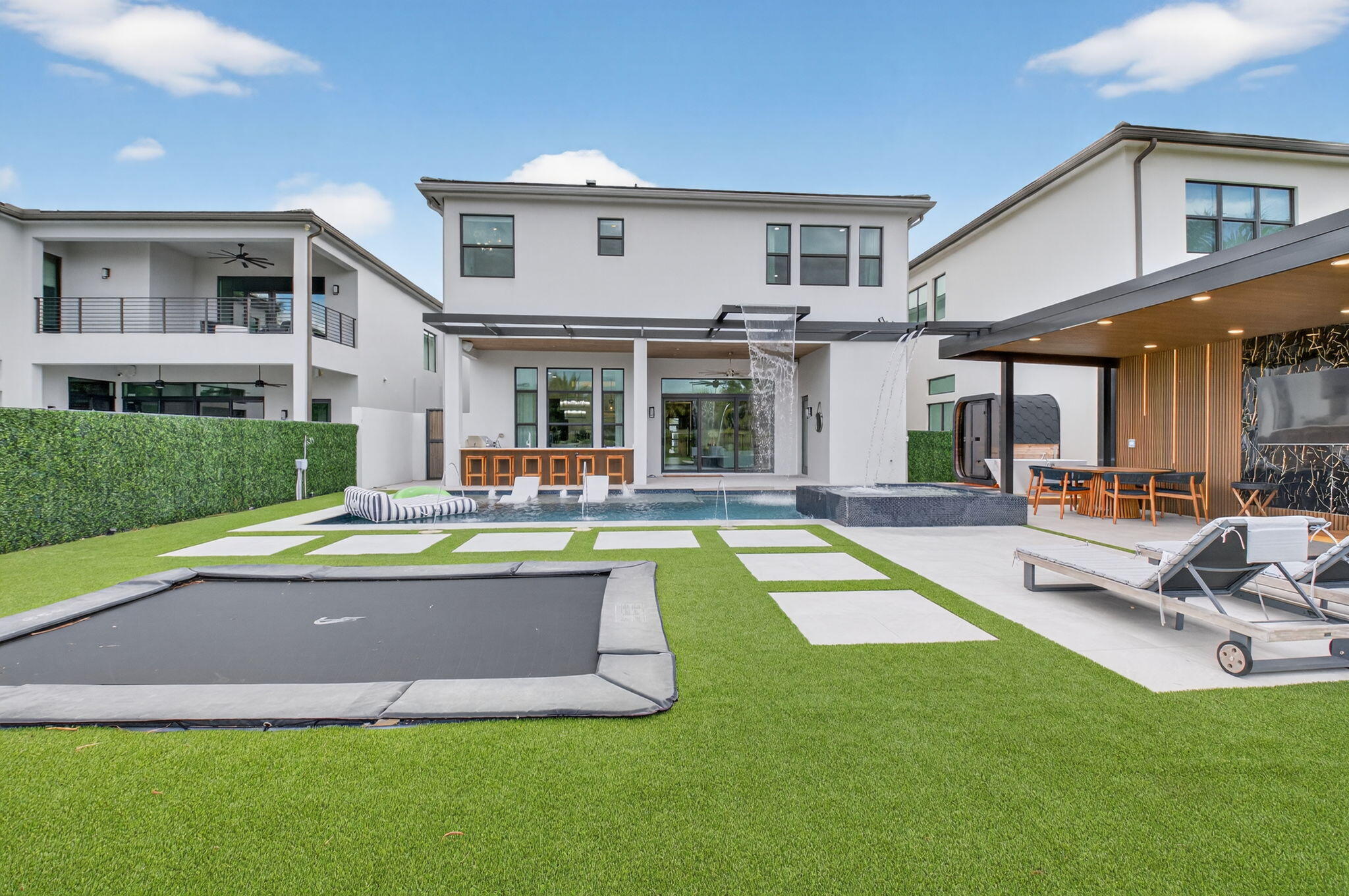 9083 Benedetta Place Boca Raton, FL 33496 - Photo 71 of 112 a view of a house with a swimming pool and sitting area