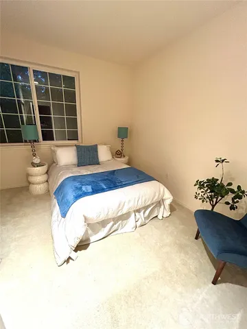 a bedroom with a bed and a couch