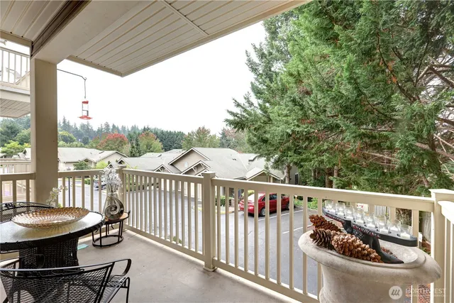 a view of a chair and table in the balcony
