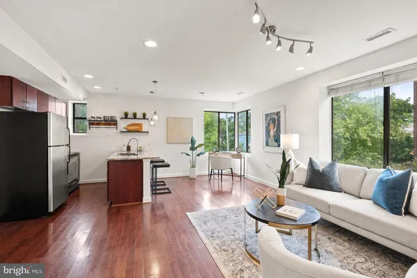 a living room with furniture and a large window