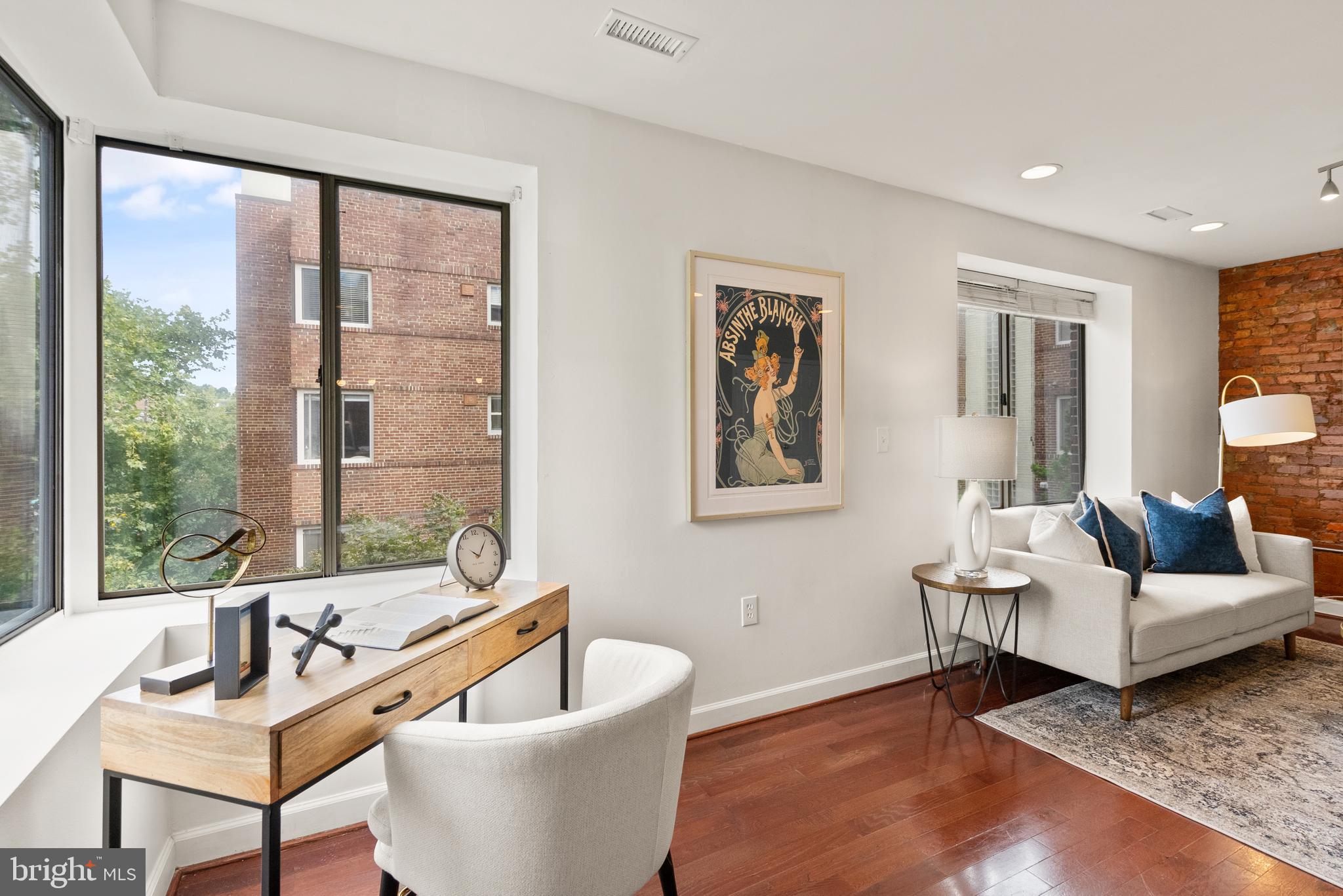 5401 9th Street Northwest, Unit 201 Washington, DC 20011 - Photo 11 of 19 a living room with furniture and a window