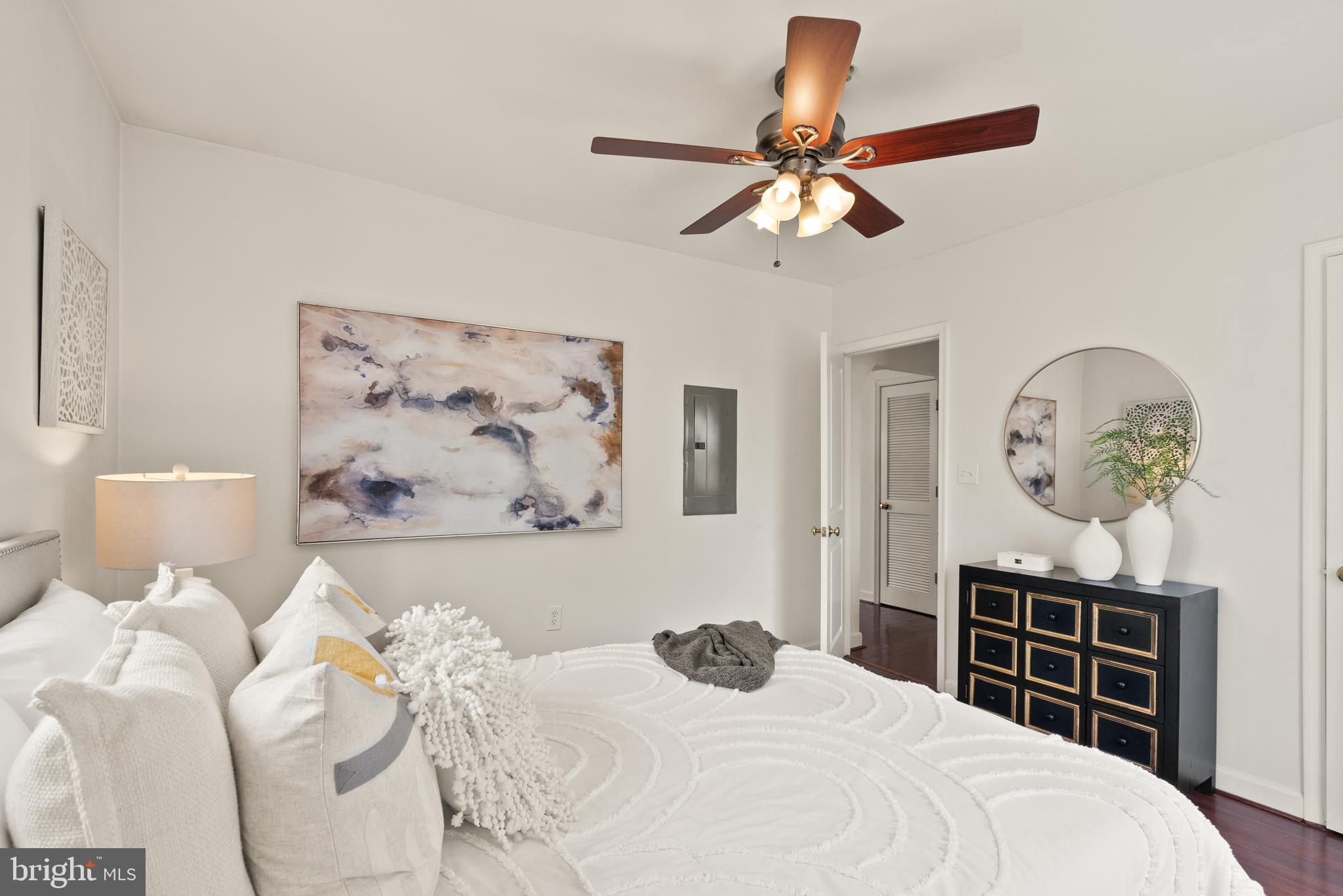 5401 9th Street Northwest, Unit 201 Washington, DC 20011 - Photo 14 of 19 a bedroom with a bed and a chandelier