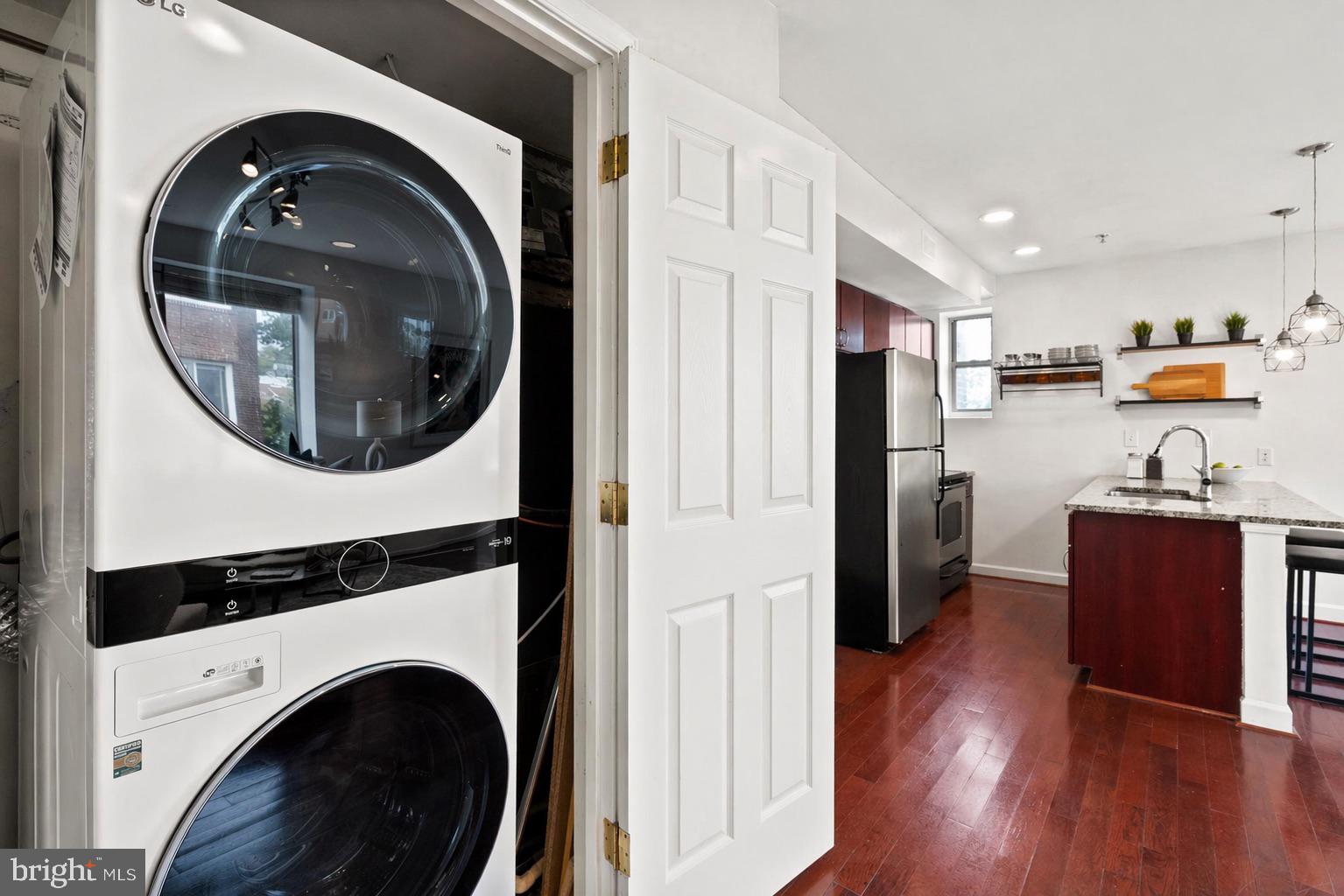 5401 9th Street Northwest, Unit 201 Washington, DC 20011 - Photo 16 of 19 a view of a kitchen with washer and dryer