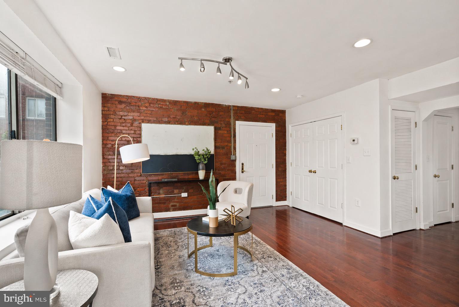 5401 9th Street Northwest, Unit 201 Washington, DC 20011 - Photo 3 of 19 a living room with furniture and a wooden floor
