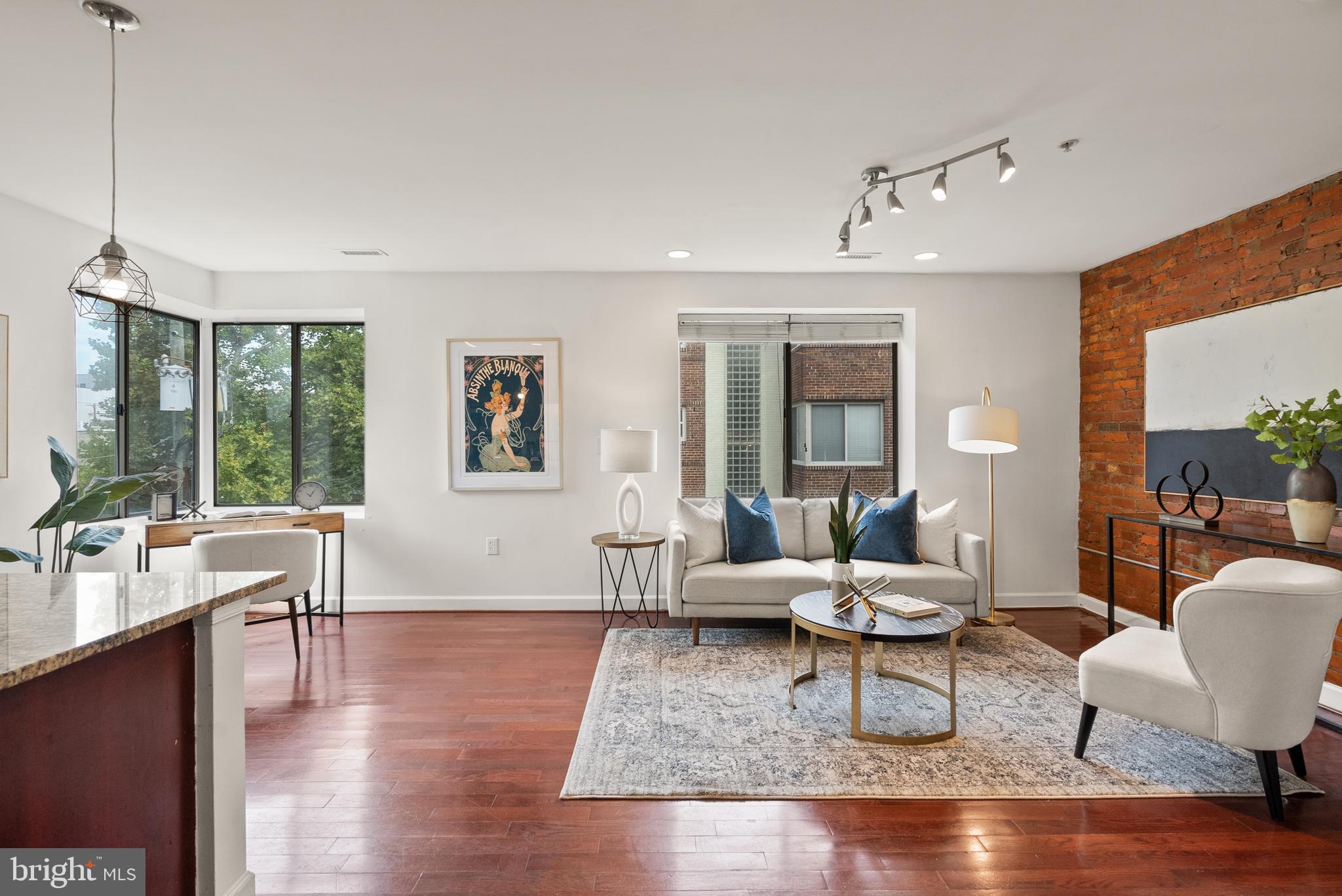 5401 9th Street Northwest, Unit 201 Washington, DC 20011 - Photo 4 of 19 a living room with furniture and wooden floor