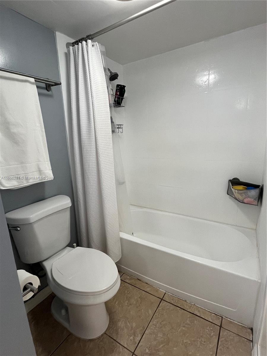 3490 Foxcroft Road, Unit B107 Miramar, FL 33025 - Photo 22 of 32 a bathroom with a toilet and a shower