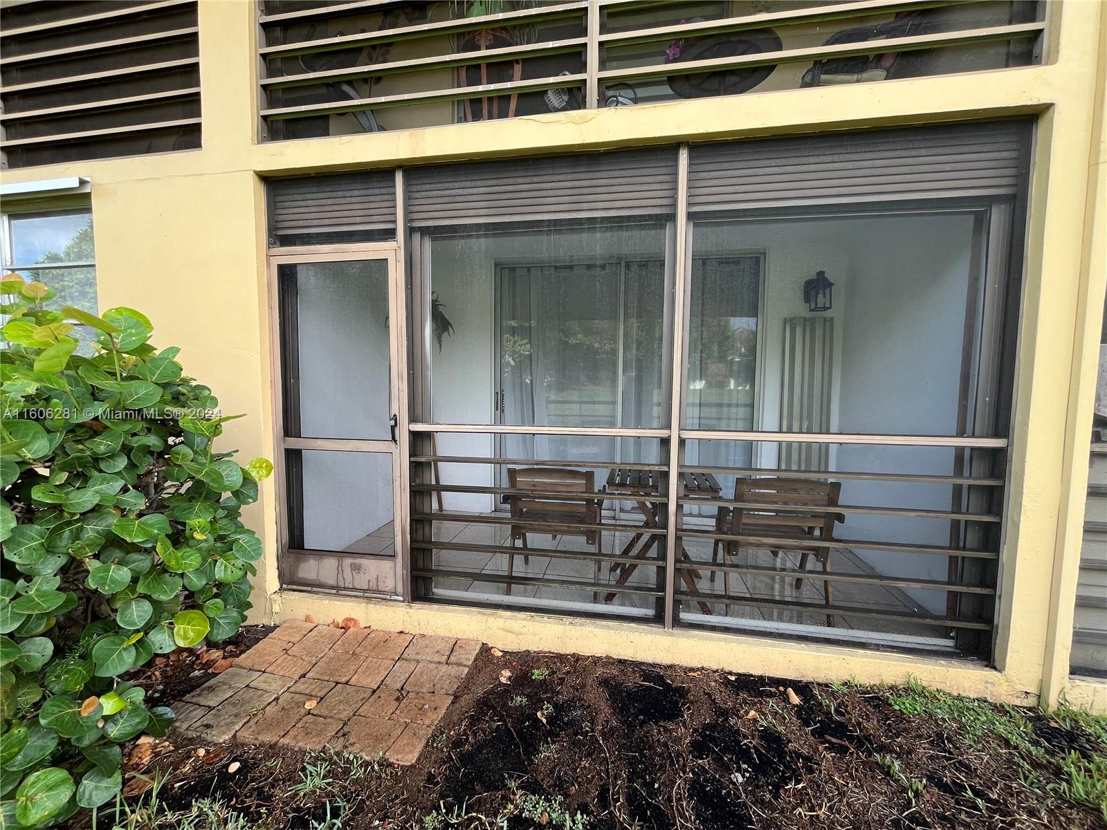 3490 Foxcroft Road, Unit B107 Miramar, FL 33025 - Photo 30 of 32 a view of front door