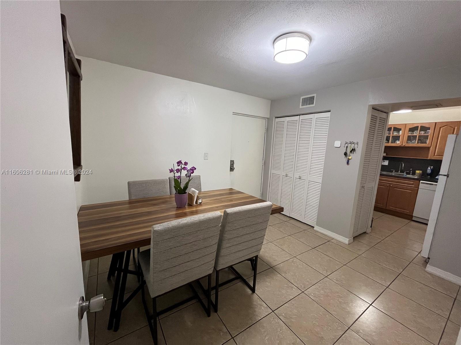3490 Foxcroft Road, Unit B107 Miramar, FL 33025 - Photo 8 of 32 a dining room with furniture and window
