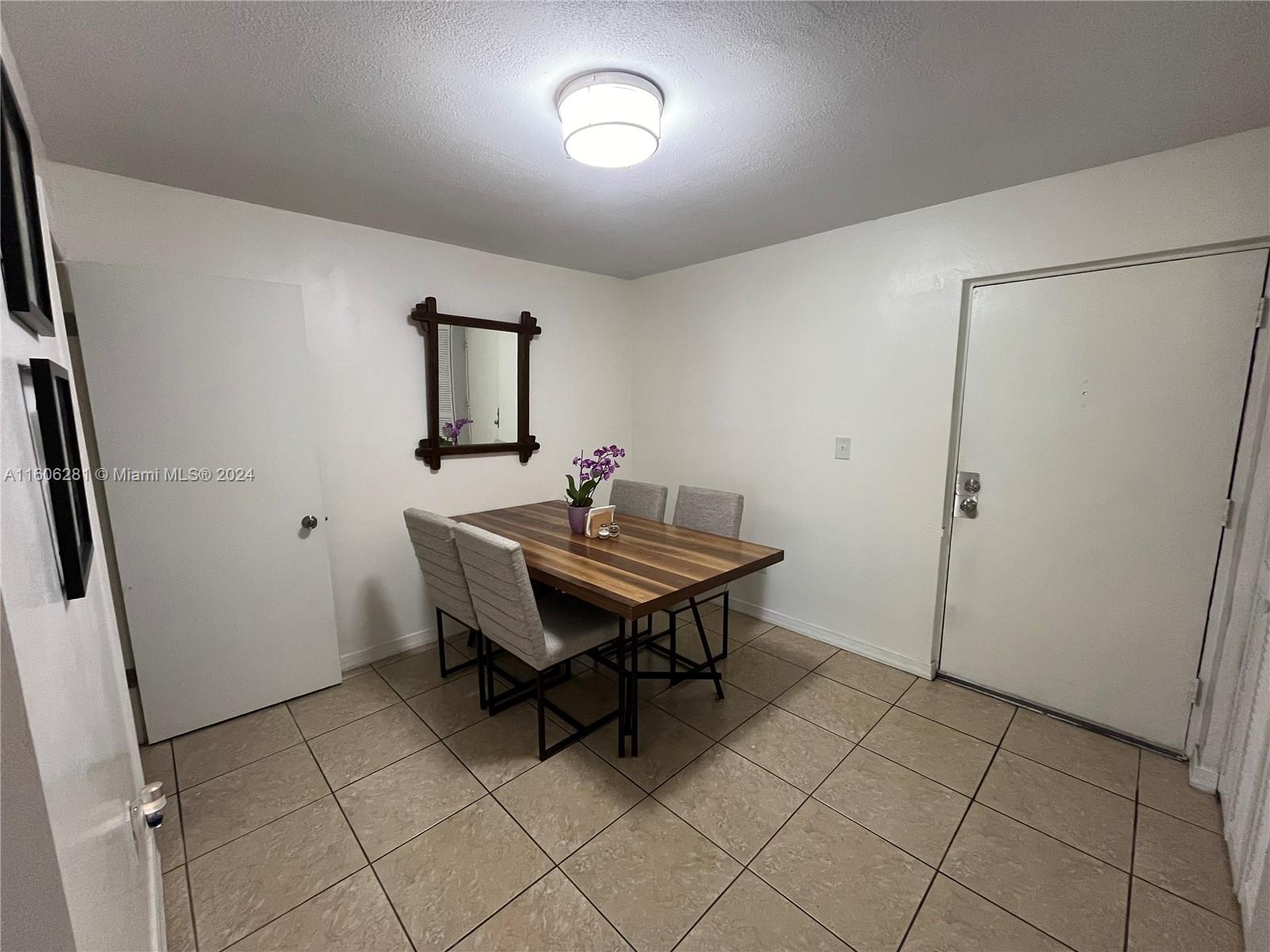 3490 Foxcroft Road, Unit B107 Miramar, FL 33025 - Photo 9 of 32 a room with furniture and a window