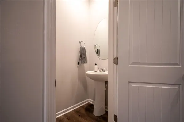 a bathroom with a sink and mirror