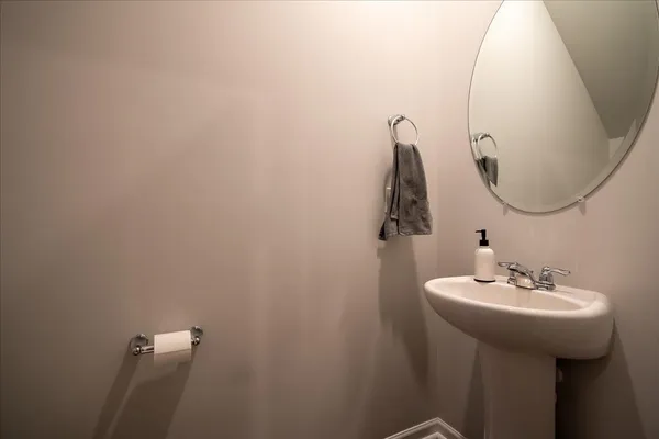 a bathroom with a sink and mirror