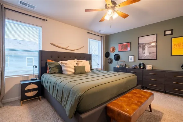 a bedroom with bed and window