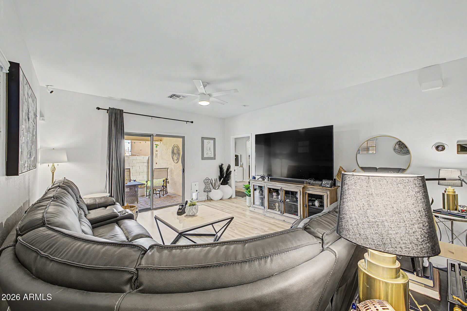 4924 West Harwell Road Laveen, AZ 85339 - Photo 5 of 27 a living room with furniture and a flat screen tv