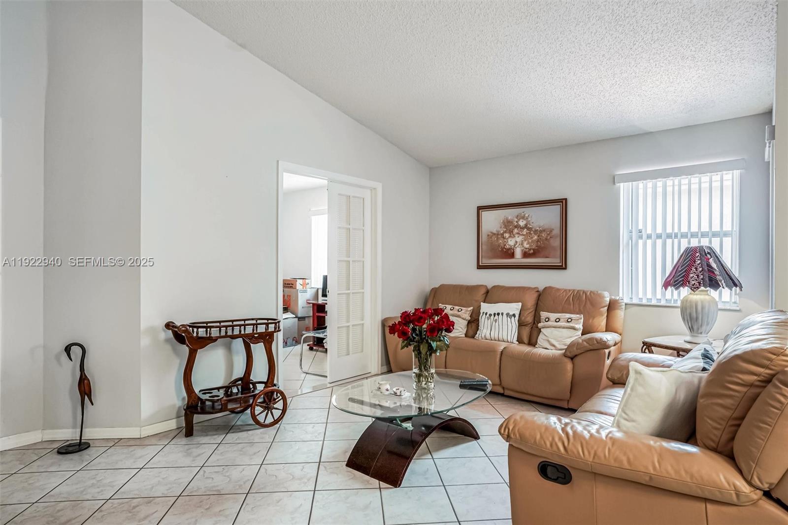 14117 Southwest 149th Avenue Miami, FL 33196 - Photo 13 of 32 a living room with furniture and a window