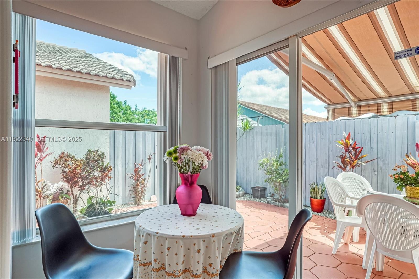 14117 Southwest 149th Avenue Miami, FL 33196 - Photo 27 of 32 a living room with furniture and a large window