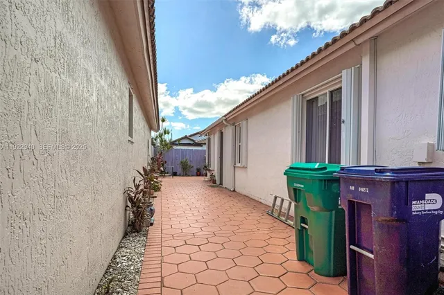 a backyard of a house with outdoor seating
