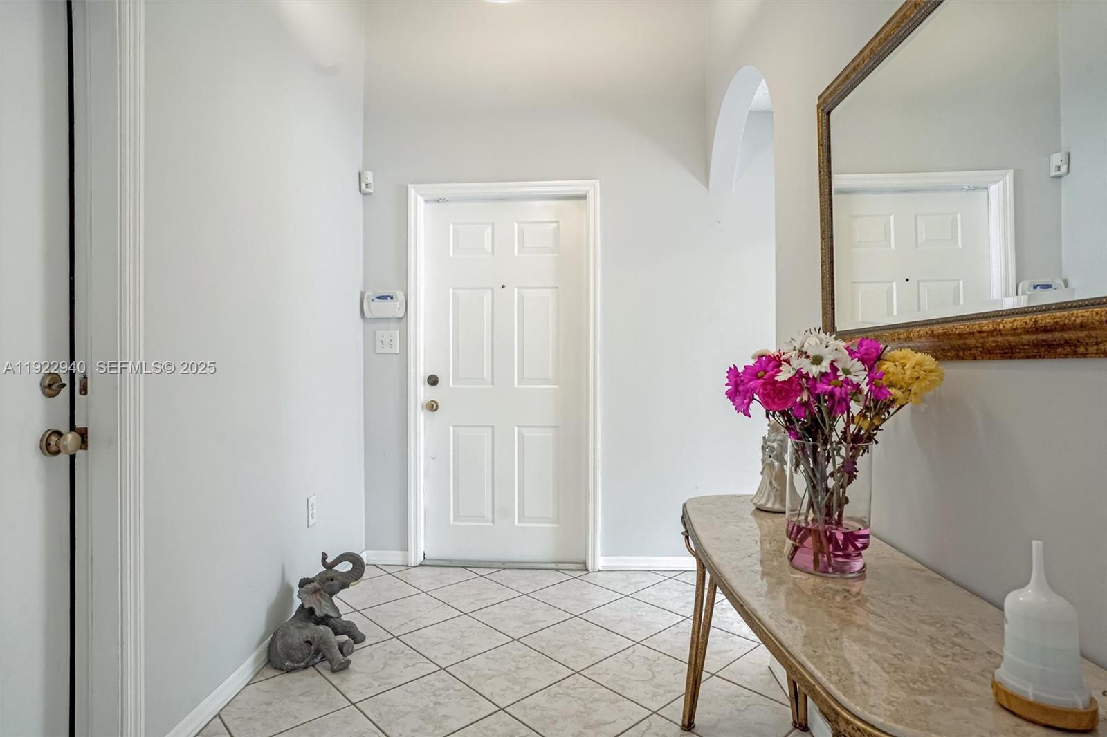 14117 Southwest 149th Avenue Miami, FL 33196 - Photo 3 of 32 a view of a dining room with furniture and wooden floor
