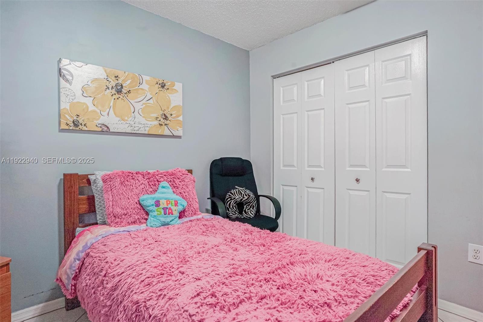 14117 Southwest 149th Avenue Miami, FL 33196 - Photo 5 of 32 a bedroom with a bed and a painting on the wall