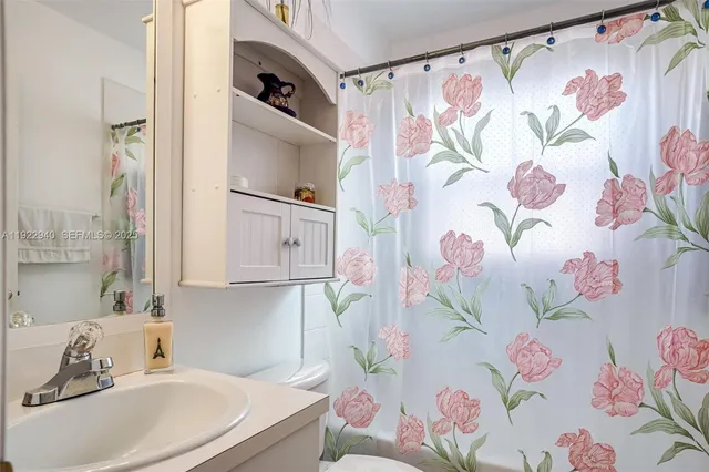 a bathroom with a sink bath tub and shower