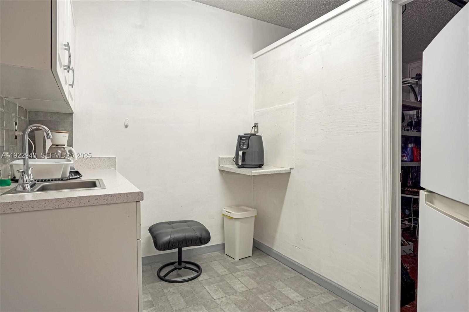 14117 Southwest 149th Avenue Miami, FL 33196 - Photo 10 of 32 a bathroom with a toilet a sink and a window