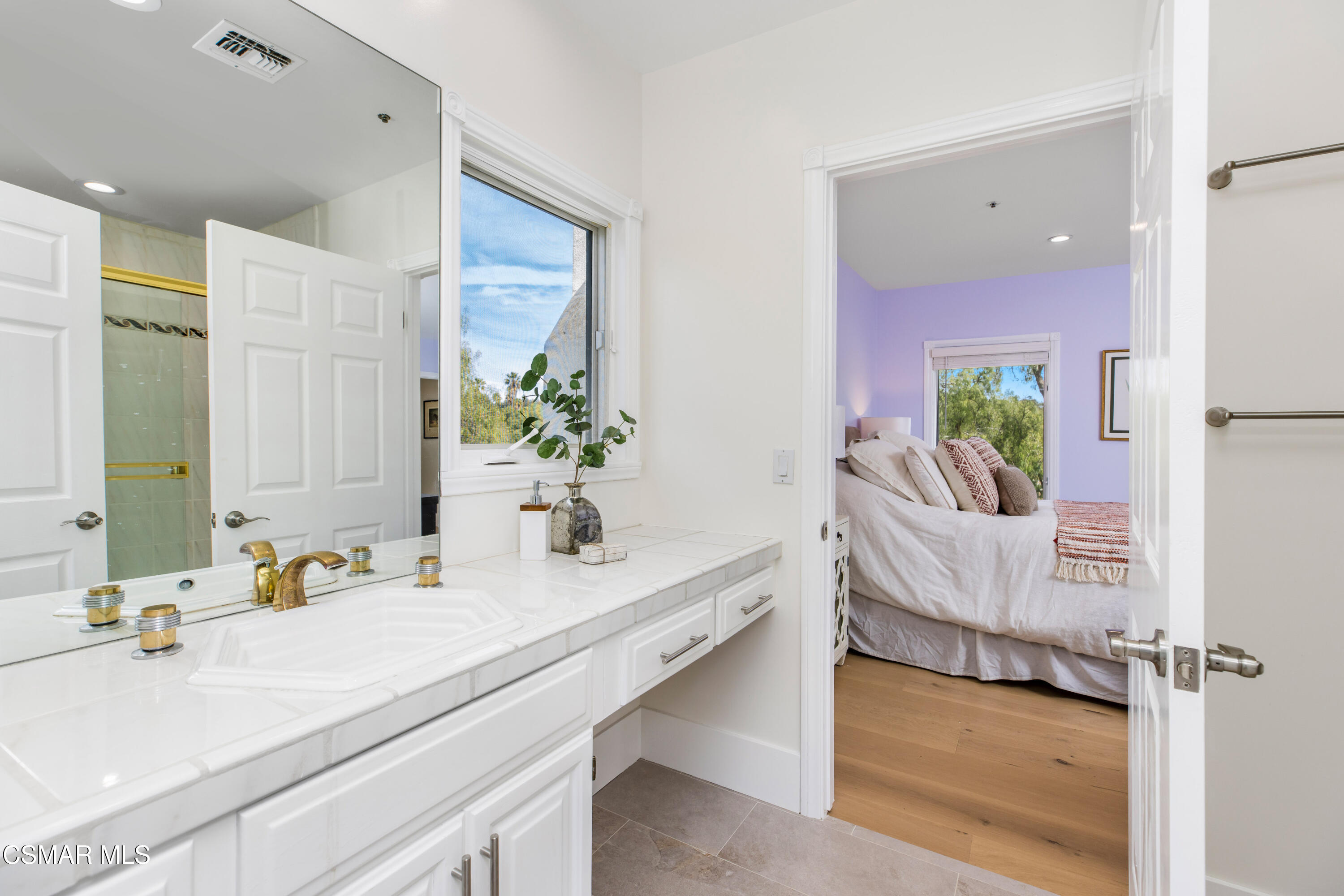 5501 Balcom Canyon Road Somis, CA 93066 - Photo 38 of 77 a en suite spacious bathroom with a granite countertop double vanity and a mirror