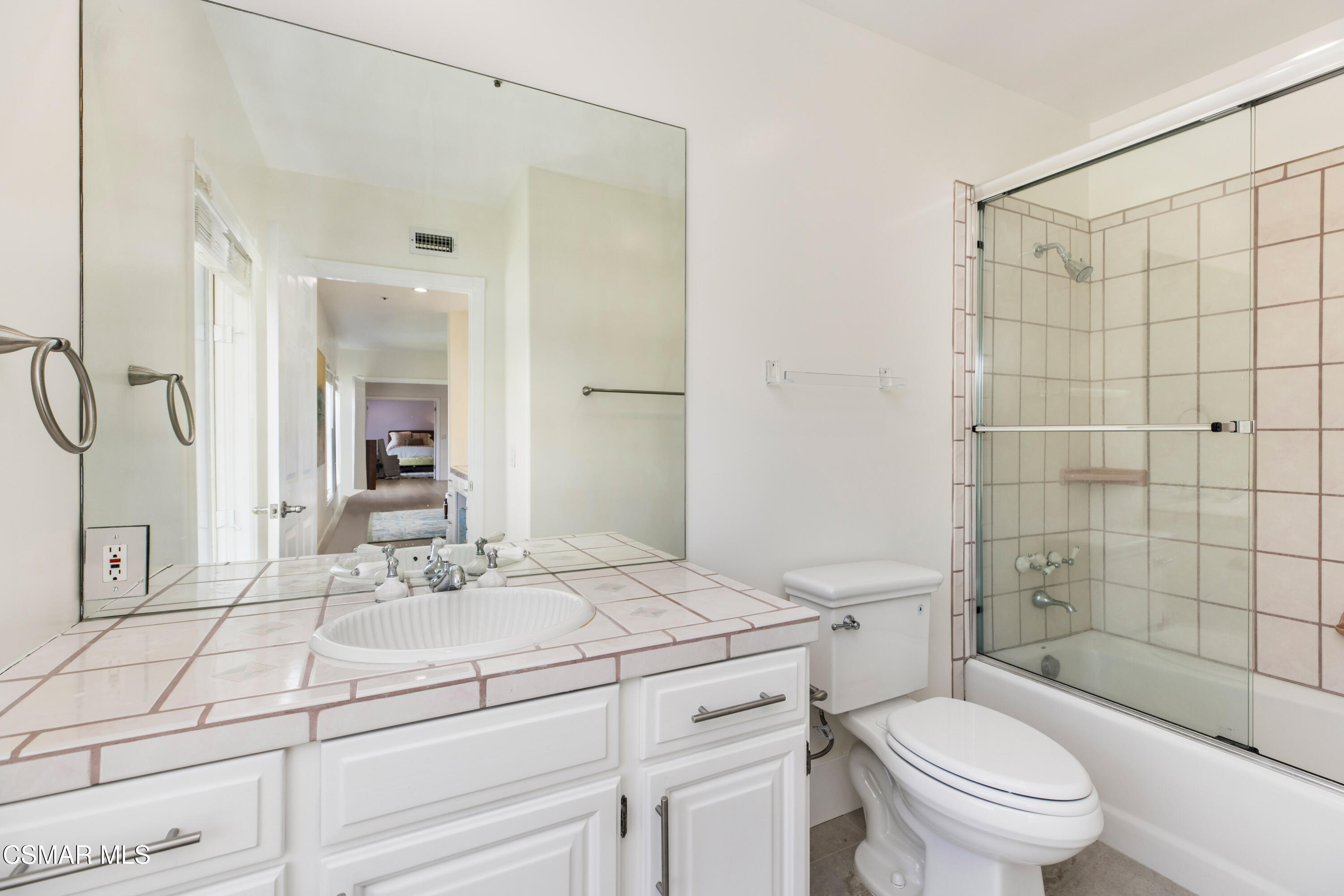 5501 Balcom Canyon Road Somis, CA 93066 - Photo 44 of 77 a bathroom with a sink toilet vanity and shower