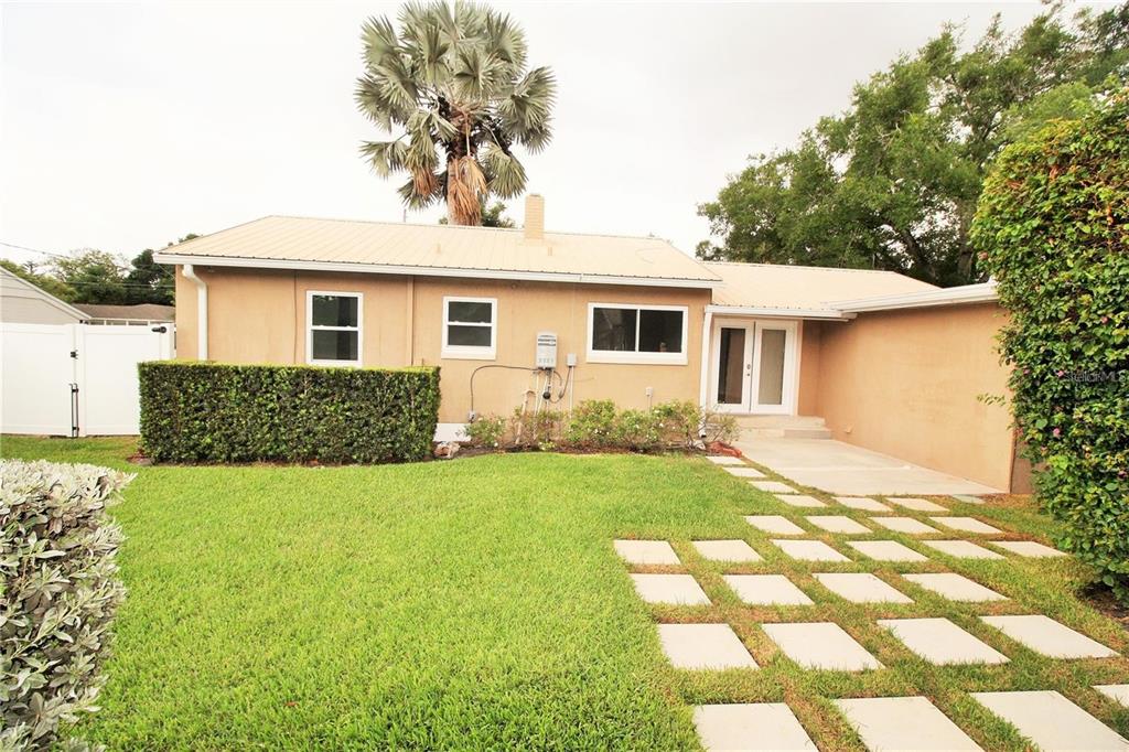 1609 Tulane Street Orlando, FL 32804 - Photo 21 of 21 a view of a backyard with plants and large tree