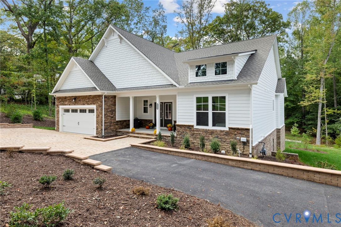 4236 Shirley Road Richmond, VA 23225 - Photo 2 of 40 a front view of a house with a garden and porch