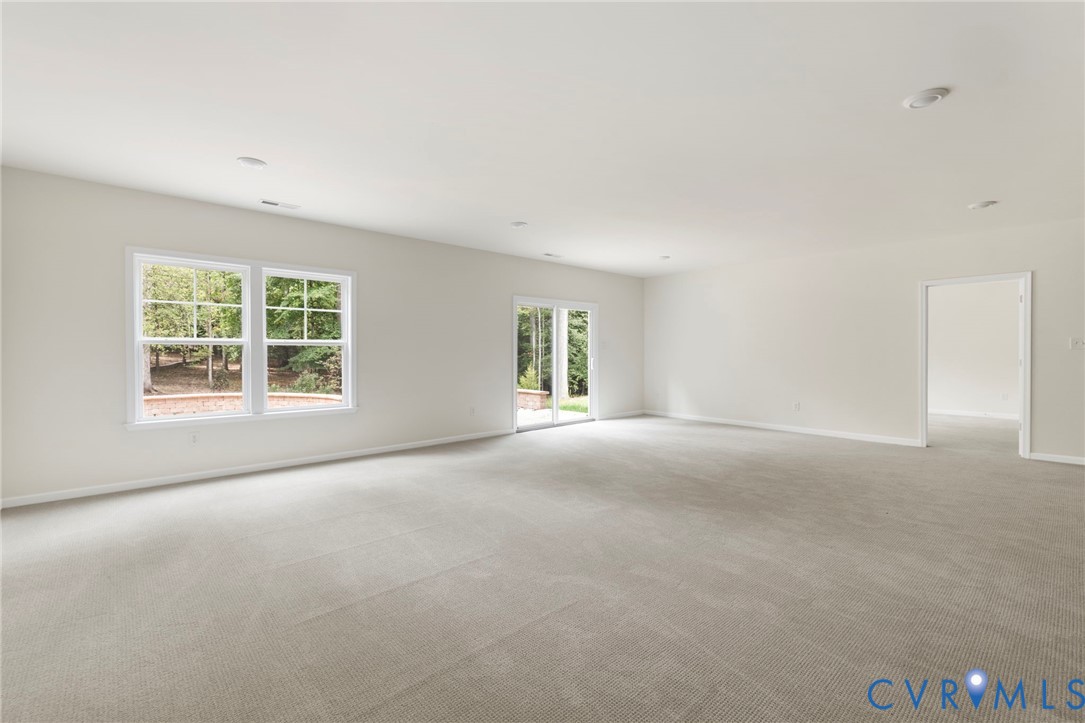 4236 Shirley Road Richmond, VA 23225 - Photo 36 of 40 a view of a big room with windows and chandelier fan