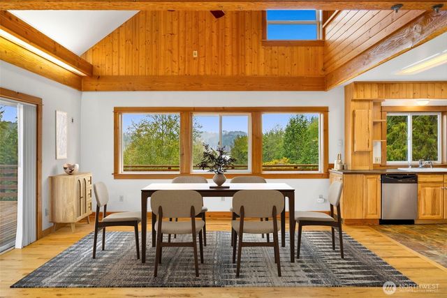 a view of a dining room with furniture window and outside view