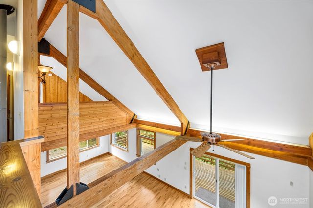 a white toilet sitting next to a shower