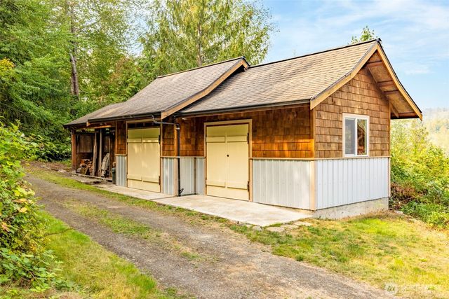 a house with trees in the background