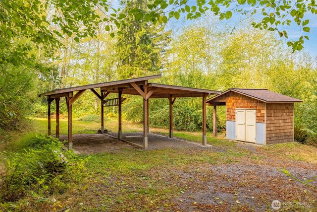 a view of a lake with a trees in the background