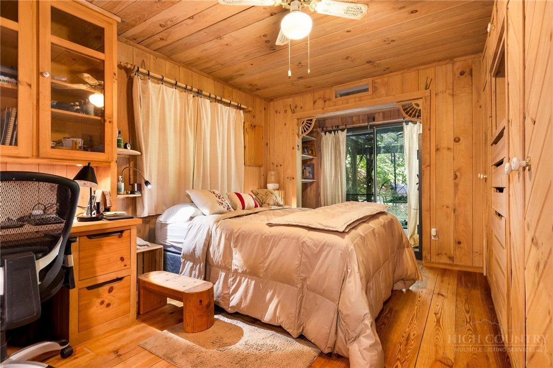 165 Natures Way Boone, NC 28607 - Photo 11 of 50 a bed sitting in a bedroom next to a window