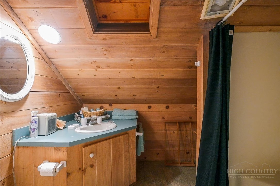165 Natures Way Boone, NC 28607 - Photo 15 of 50 a bathroom with a sink and a mirror