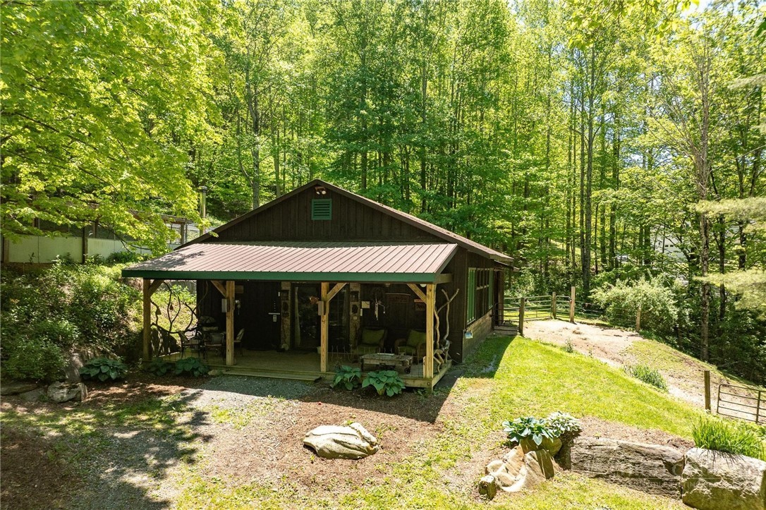 165 Natures Way Boone, NC 28607 - Photo 20 of 50 a backyard of a house with yard and outdoor seating