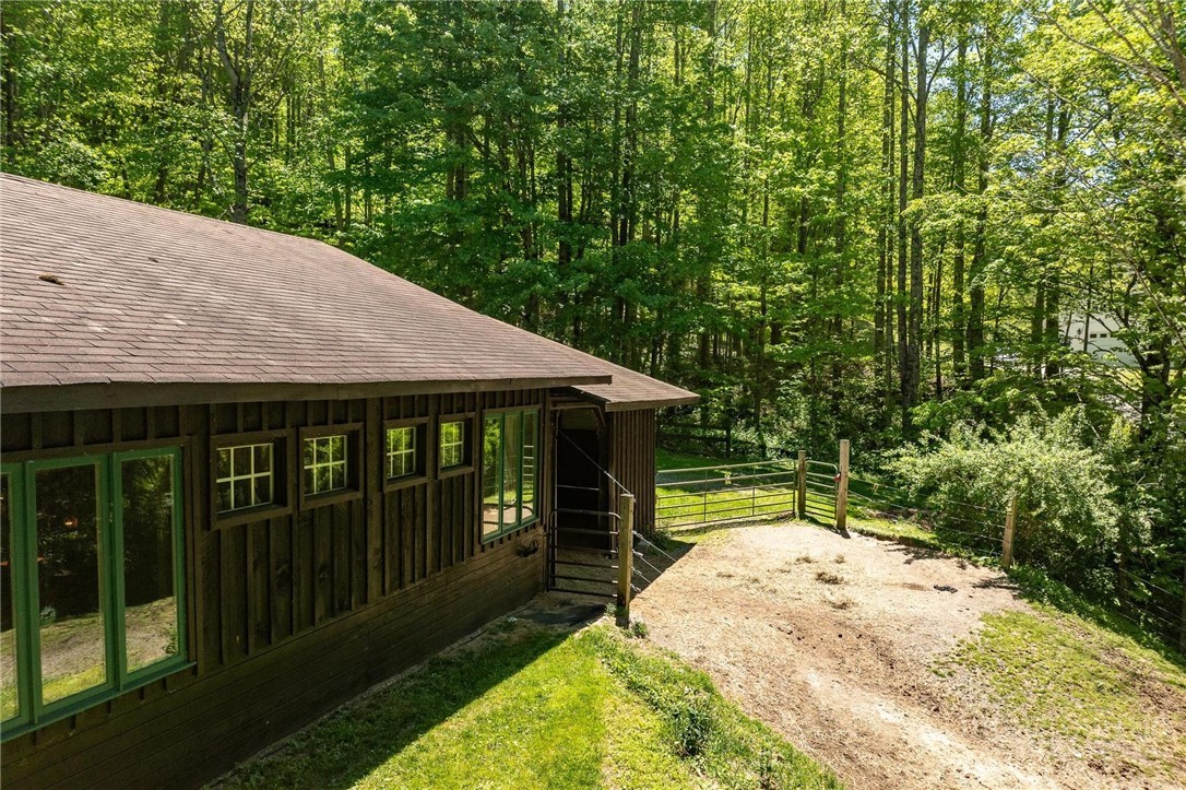 165 Natures Way Boone, NC 28607 - Photo 21 of 50 a backyard of a house with table and chairs