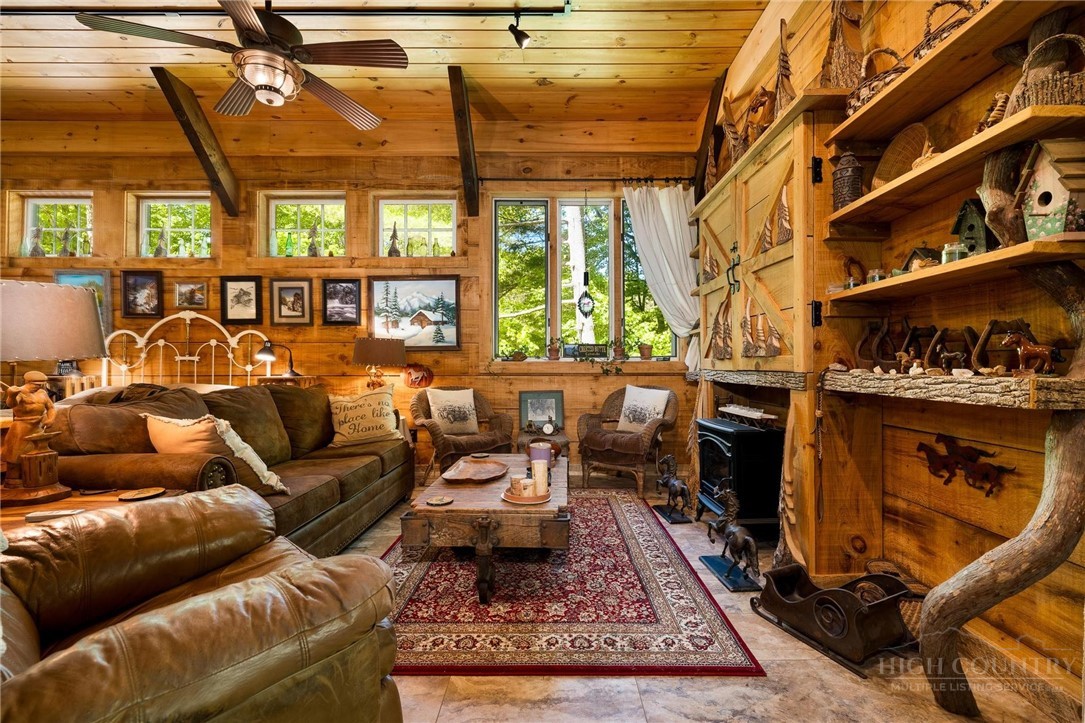 165 Natures Way Boone, NC 28607 - Photo 22 of 50 a living room with furniture a rug and a table