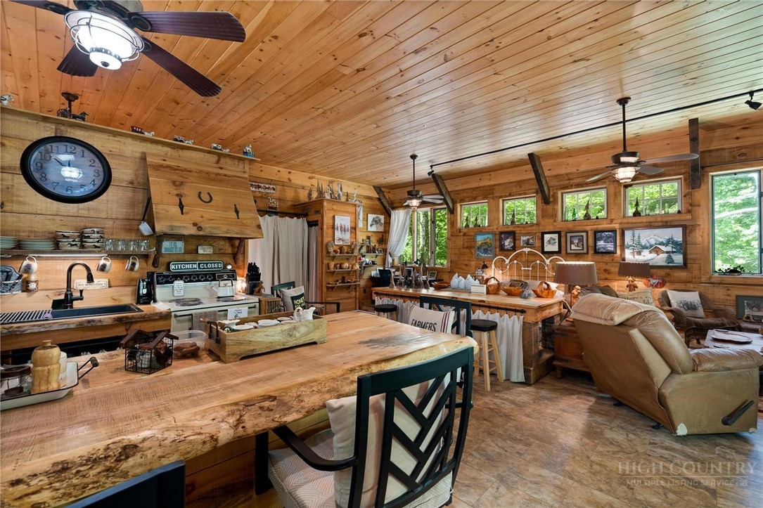 165 Natures Way Boone, NC 28607 - Photo 24 of 50 a view of a dining room with furniture window and outside view
